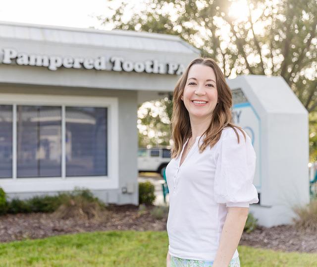 Dr. Larissa W. Hanson outside The Pampered Tooth.