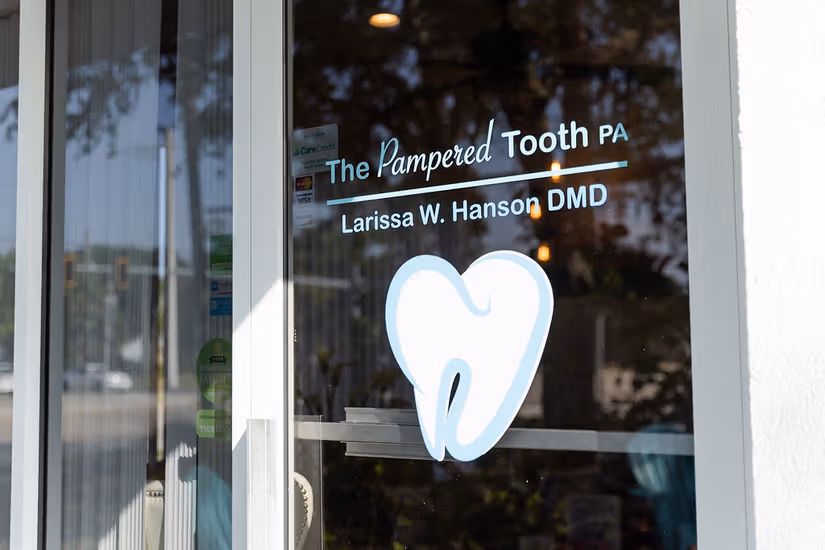 The Pampered Tooth front door and practice branding.