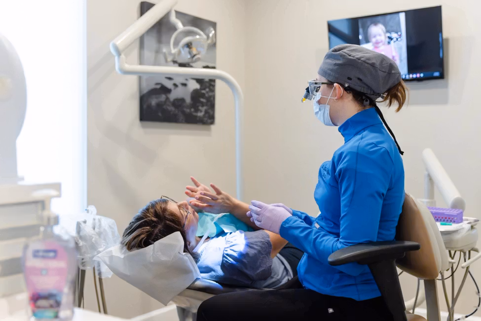 A patient receives attentive restorative dental treatment.